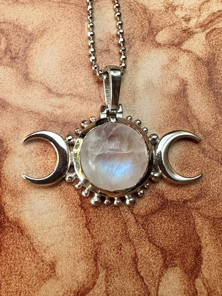 Hecate Triple Moon symbol on sterling silver pendant.